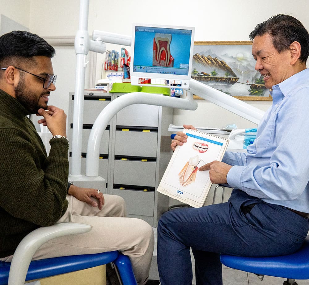 Dr-Toan-with-patient-showing-image